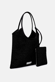 Borsa Nela Maxi nera TWENTYFOURHAITCH, vista tre quarti con portafoglio.